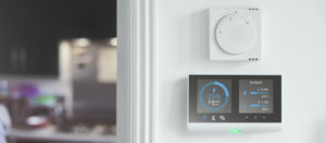 Smart meter and thermostat on wall.