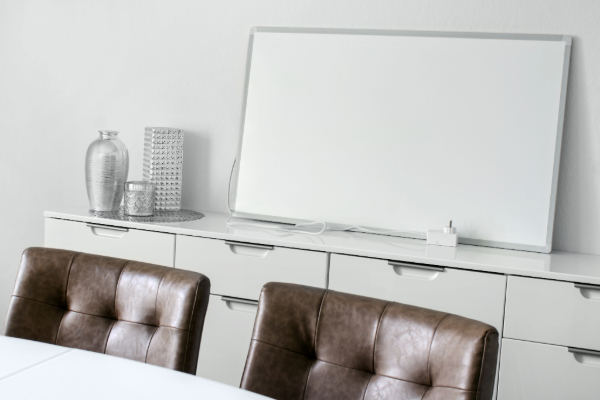 White infrared heating panel leaning against a wall