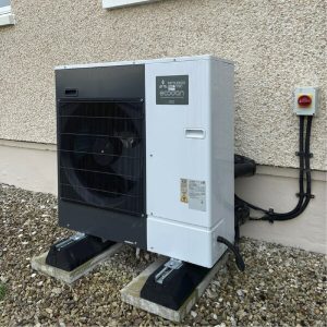 an air source heat pump outside a house